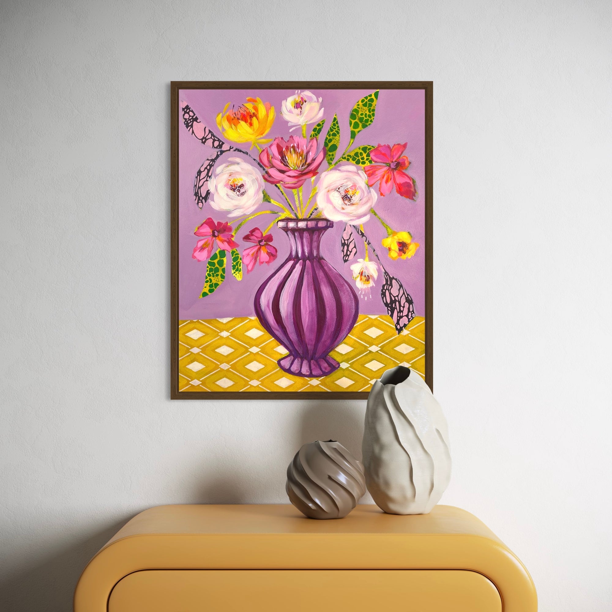 Stylised flower in vase painting mauve and mustard, framed in oak above yellow drawers